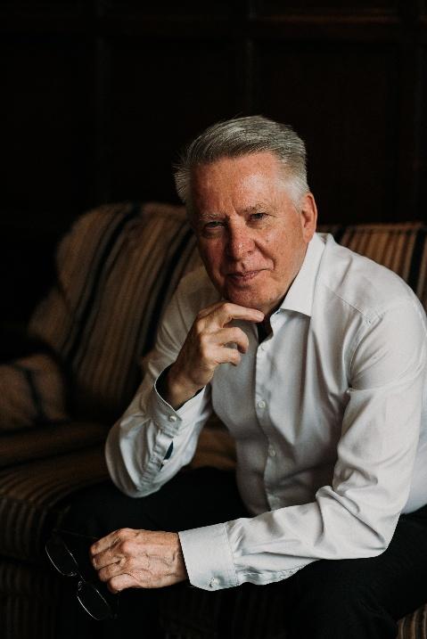 Nick sitting thoughtfully, reflecting on his own experience of divorce